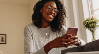 Woman on a mobile phone smiling