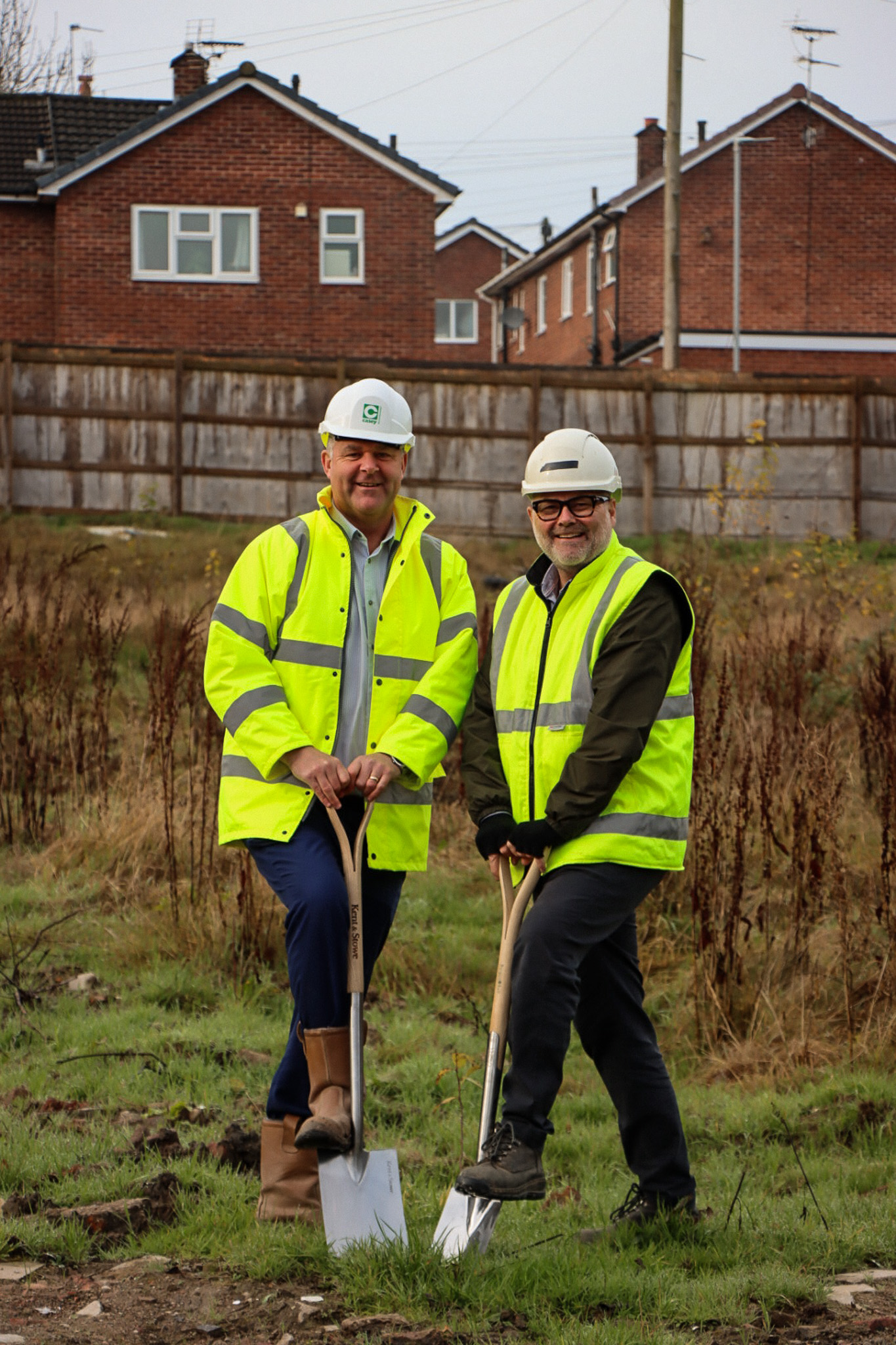 Two men with spades at Ivy Road developement